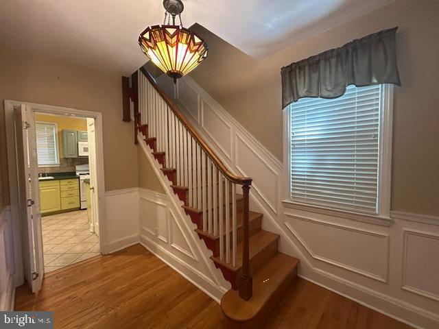 306 Kingston Road Baltimore, MD 21229 - Photo 3 of 17 a view of entryway and hall with wooden floor
