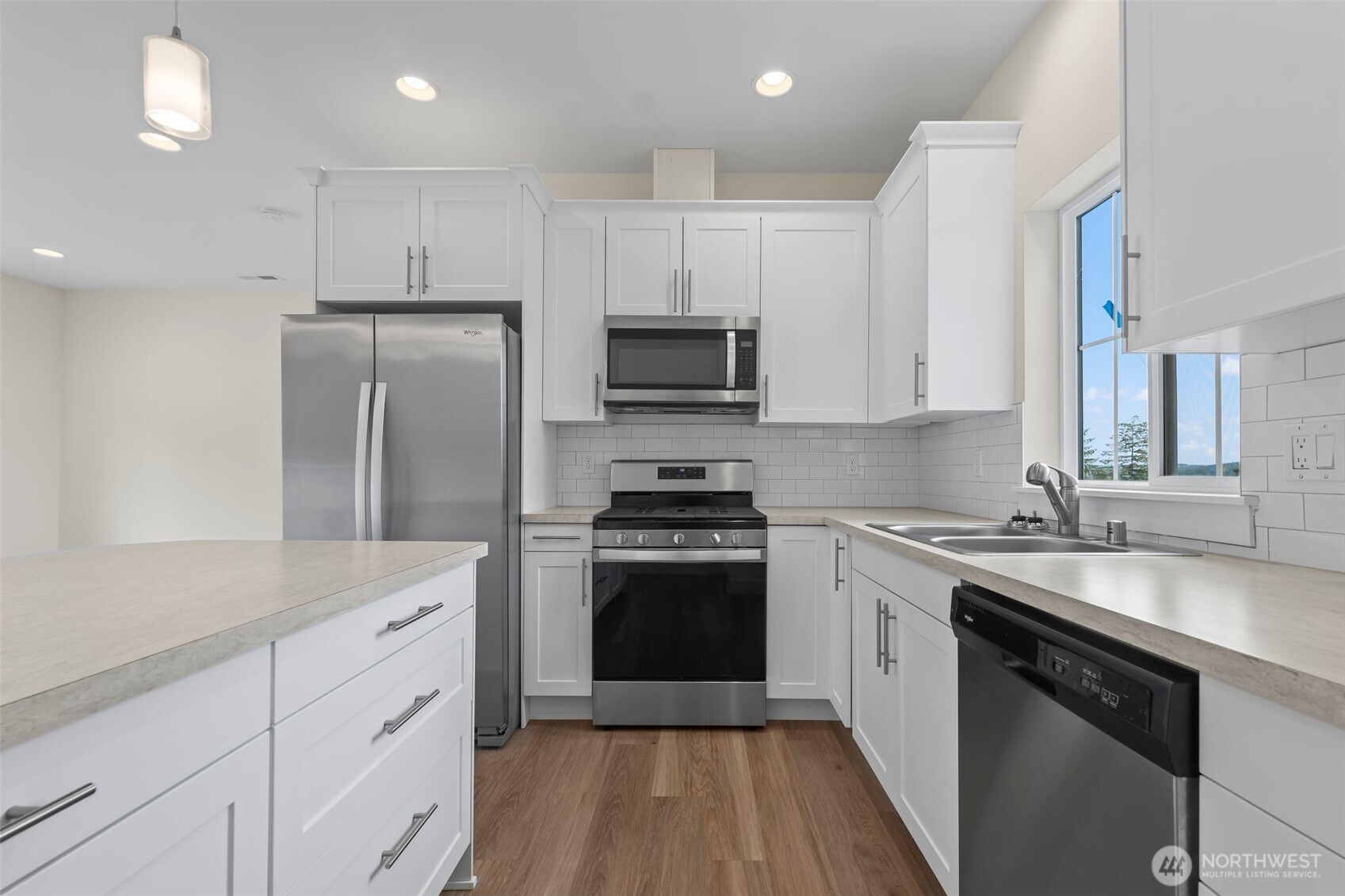 19013 Highway 3, Unit B Allyn, WA 98524 - Photo 5 of 22 a kitchen with a sink stove and refrigerator