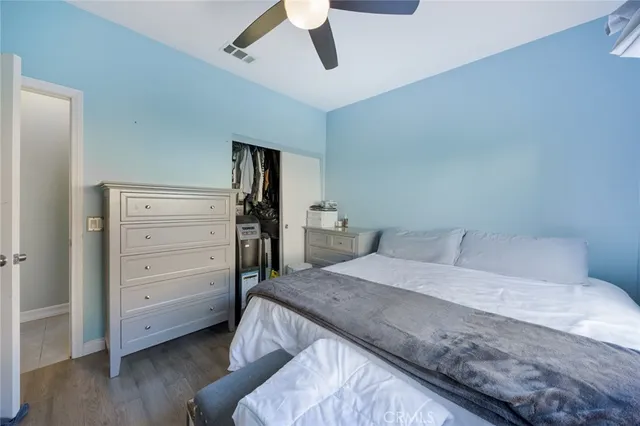 a bedroom with a bed and a closet