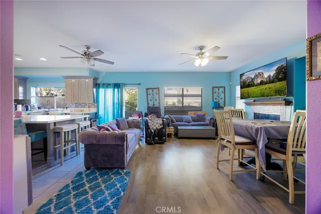 a living room with furniture fireplace and a flat screen tv