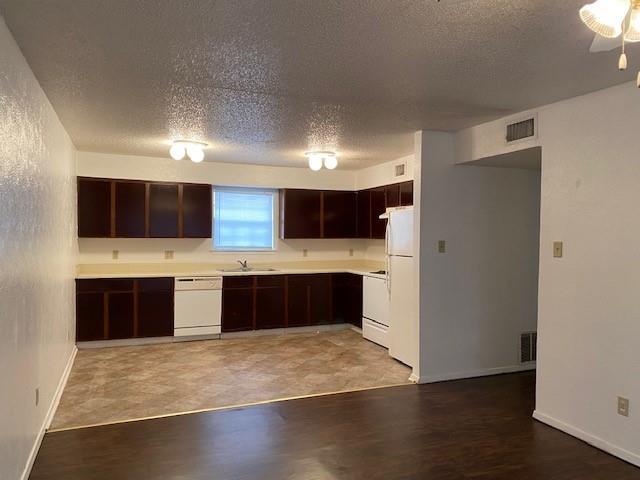 a large kitchen with a large counter top space and stainless steel appliances
