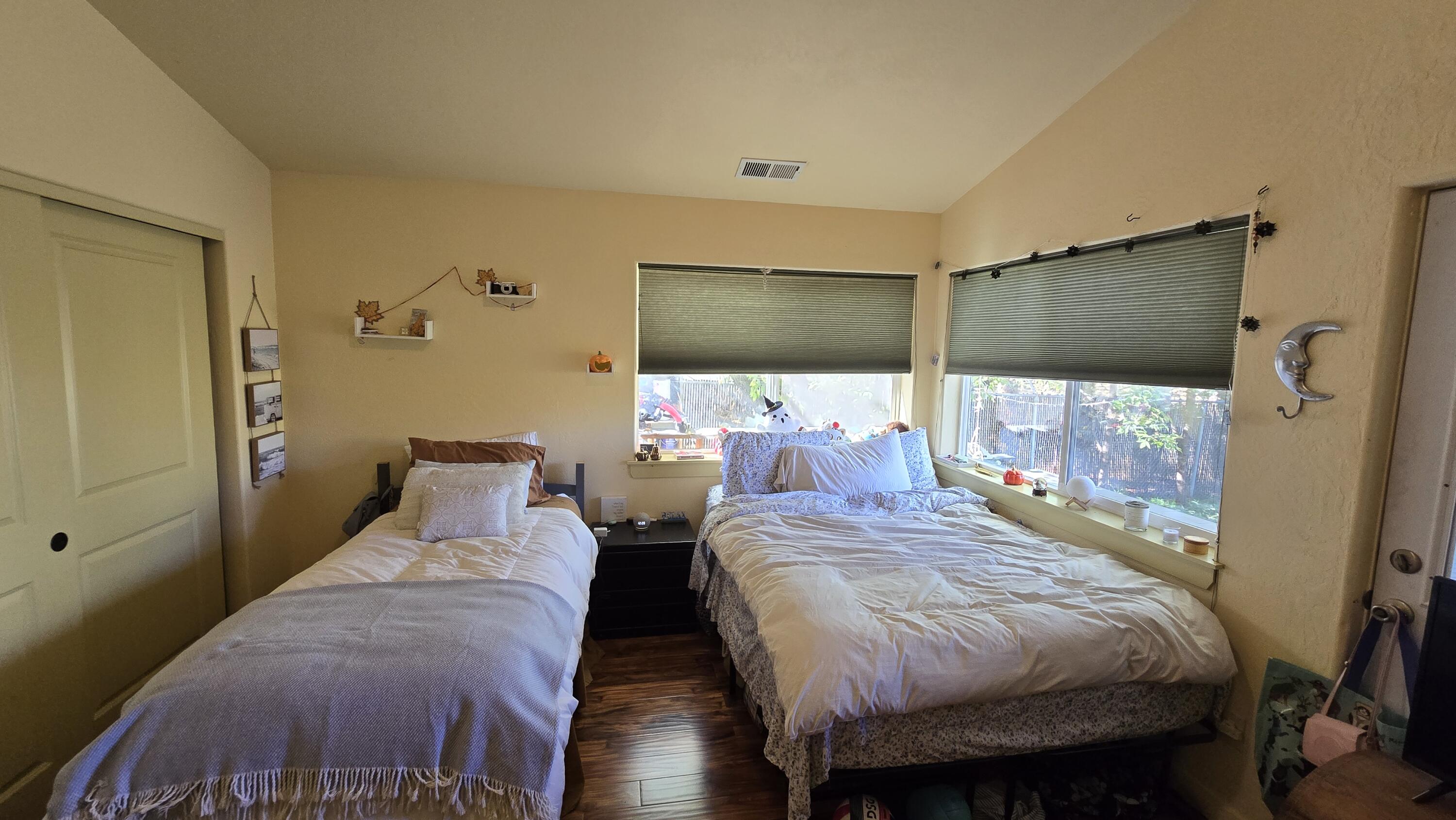 488 Crowson Road Ashland, OR 97520 - Photo 12 of 30 a bedroom with two beds and a flat screen tv