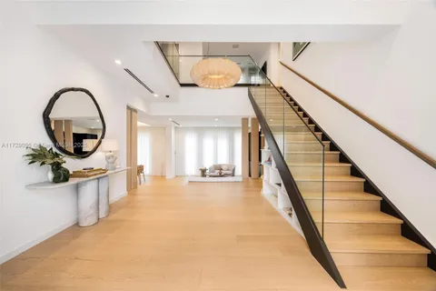 a view of kitchen with cabinets and window