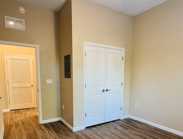 a view of room with wooden floor