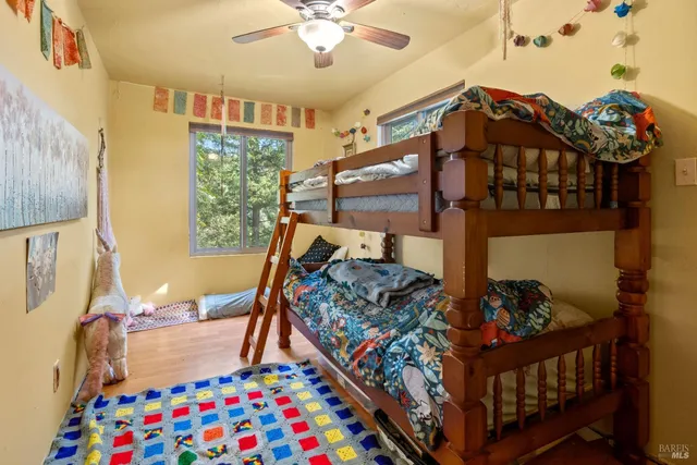a bed room with furniture and a baby crib