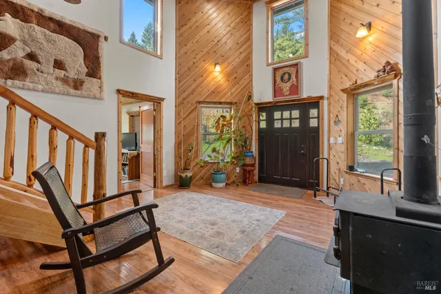a view of a brick house with large windows and table