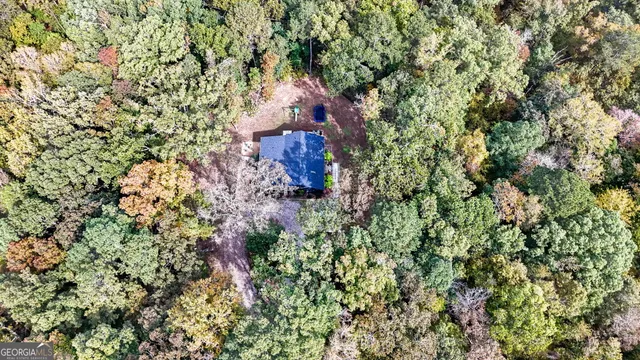 a view of a house with a tree