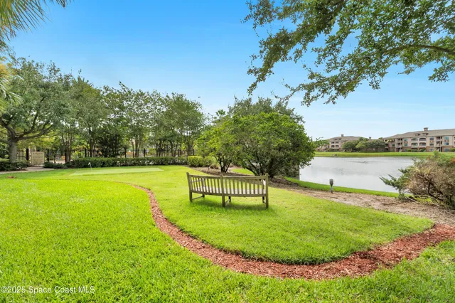 a view of a lake with a garden