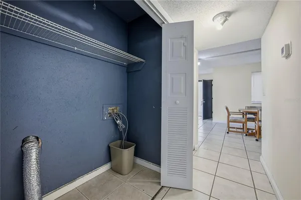 a view of a hallway with chairs