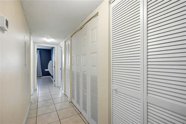 a view of a hallway and closet