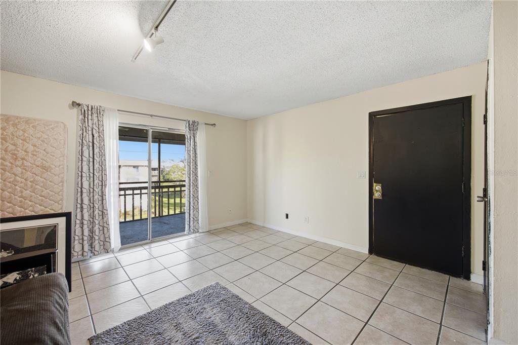 6519 West Newberry Road, Unit 109 Gainesville, FL 32605 - Photo 4 of 21 a view of an empty room and window