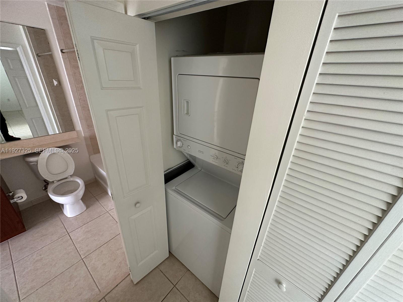 2401 Northeast 65th Street, Unit 606 Fort Lauderdale, FL 33308 - Photo 11 of 19 a view of washer and dryer