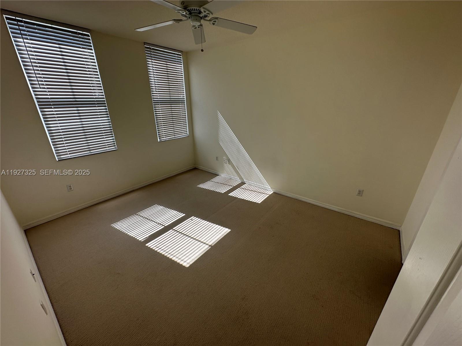 2401 Northeast 65th Street, Unit 606 Fort Lauderdale, FL 33308 - Photo 12 of 19 a view of an empty room with a window