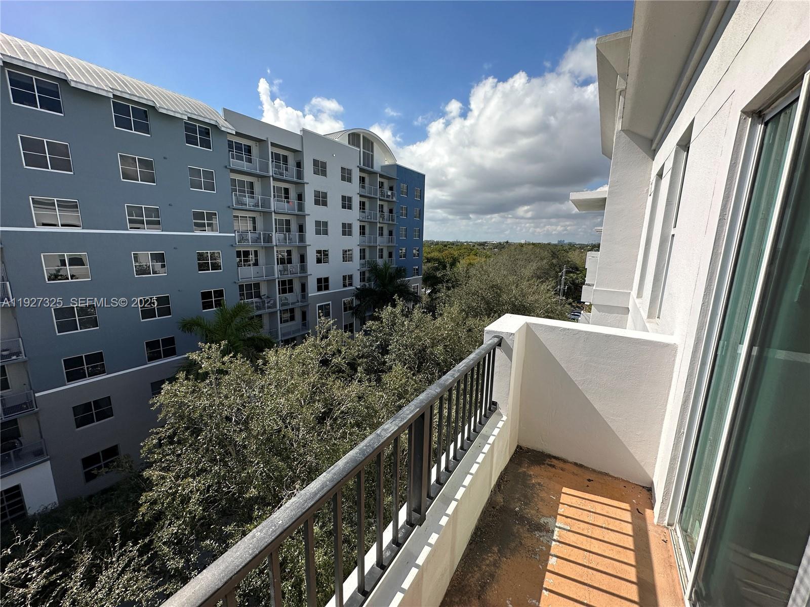 2401 Northeast 65th Street, Unit 606 Fort Lauderdale, FL 33308 - Photo 16 of 19 a view of balcony with furniture