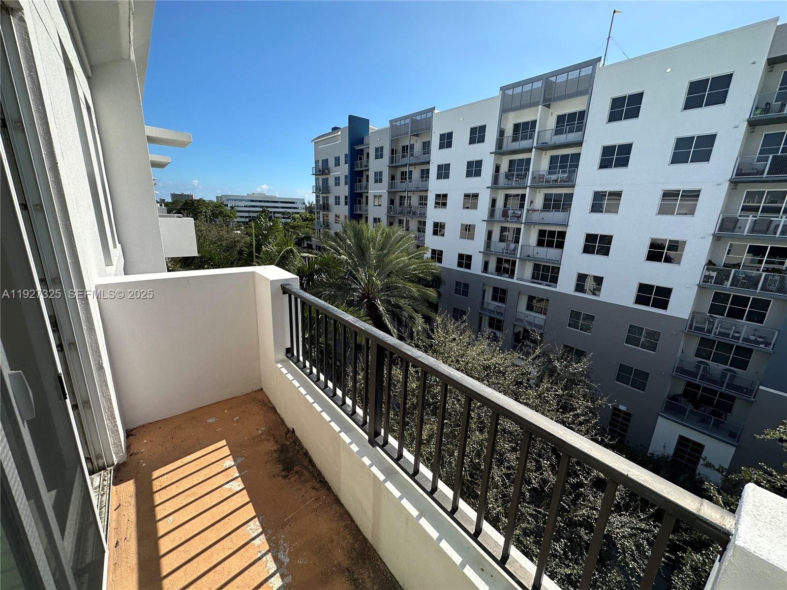 2401 Northeast 65th Street, Unit 606 Fort Lauderdale, FL 33308 - Photo 18 of 19 a balcony with street view