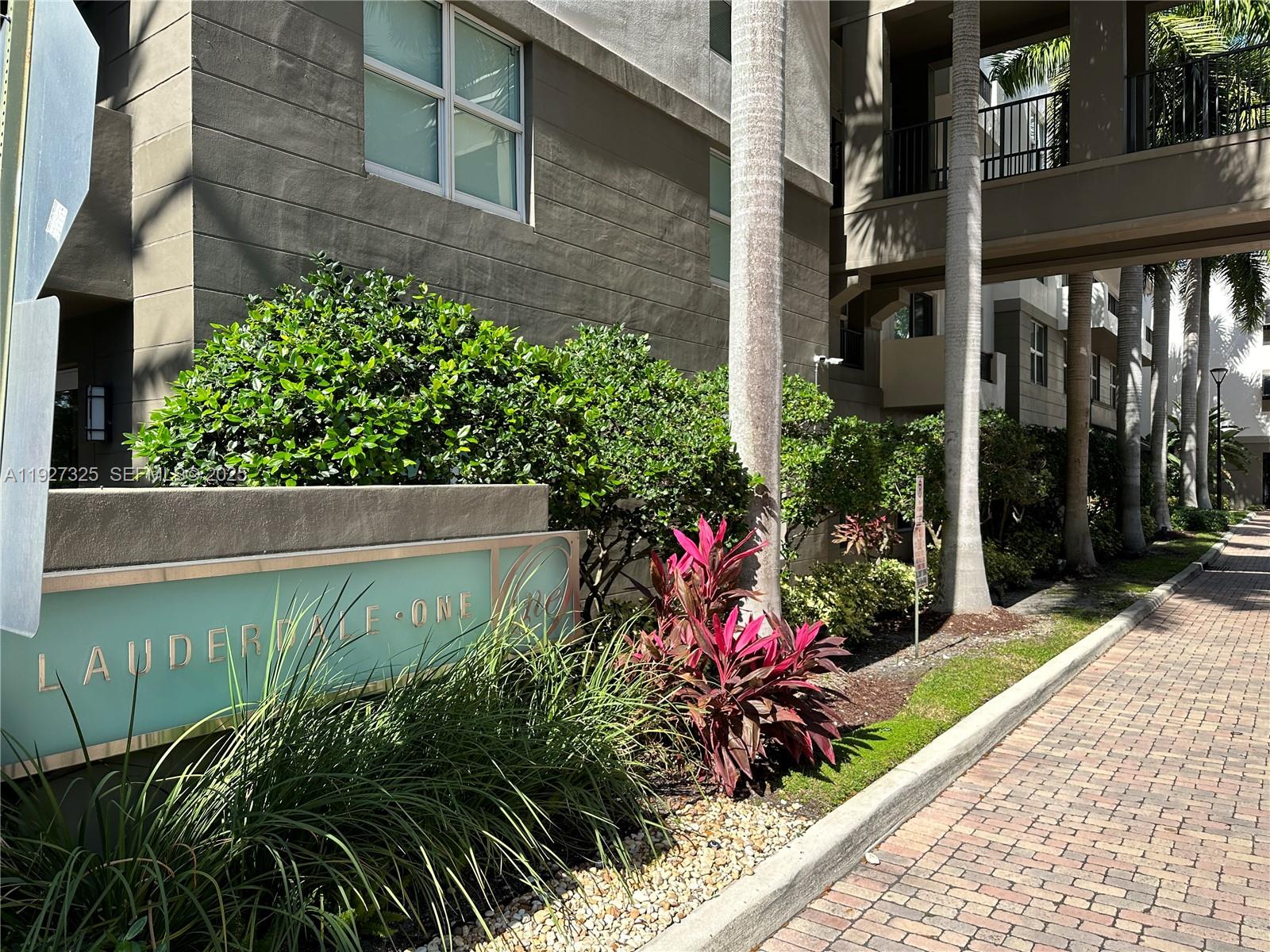 2401 Northeast 65th Street, Unit 606 Fort Lauderdale, FL 33308 - Photo 3 of 19 a view of a garden with potted plants