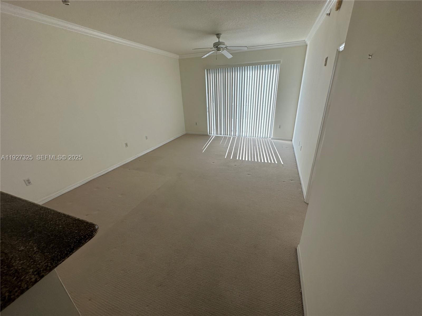 2401 Northeast 65th Street, Unit 606 Fort Lauderdale, FL 33308 - Photo 6 of 19 an empty room with windows