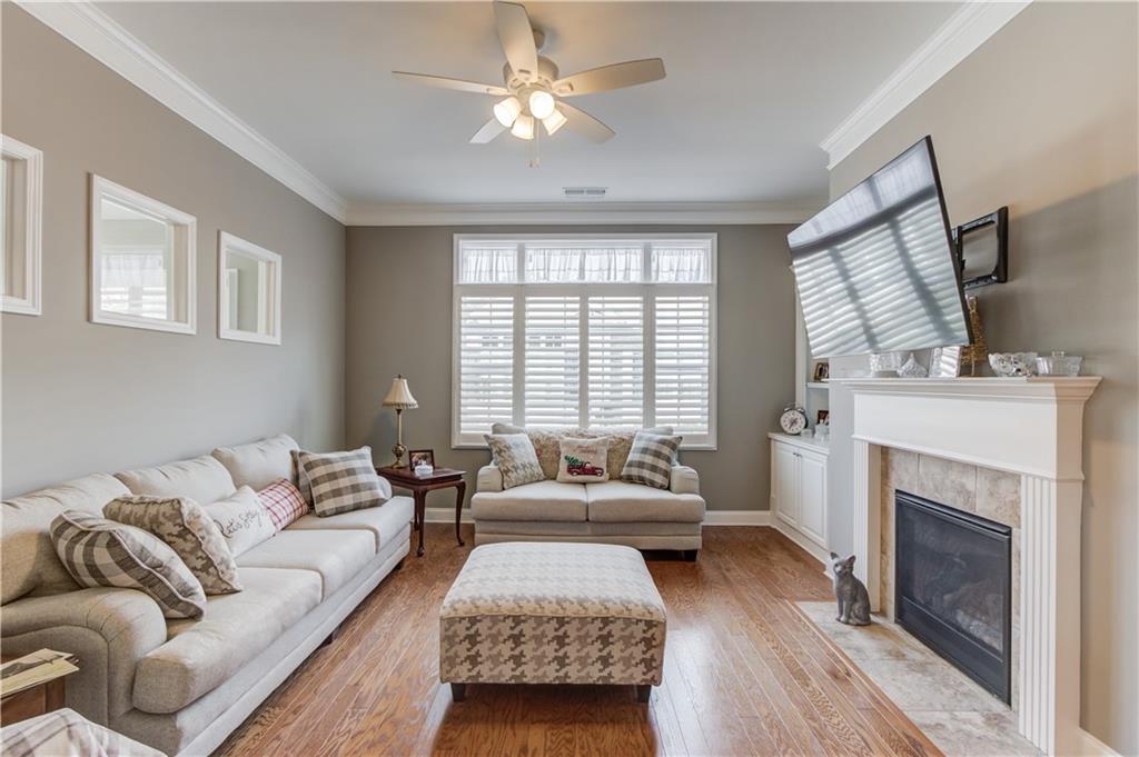 3675 Ridgehurst Drive Buford, GA 30519 - Photo 13 of 43 a living room with furniture and a fireplace