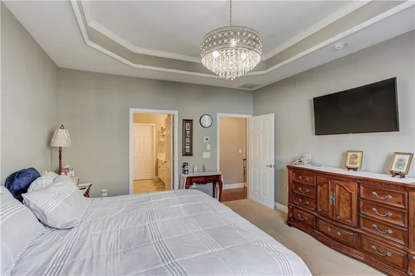 a spacious bathroom with a double vanity sink a mirror and a shower