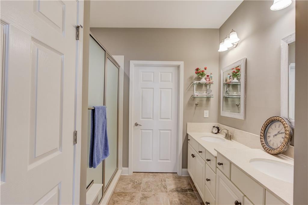 3675 Ridgehurst Drive Buford, GA 30519 - Photo 24 of 43 a spacious bathroom with a double vanity sink a mirror and a shower