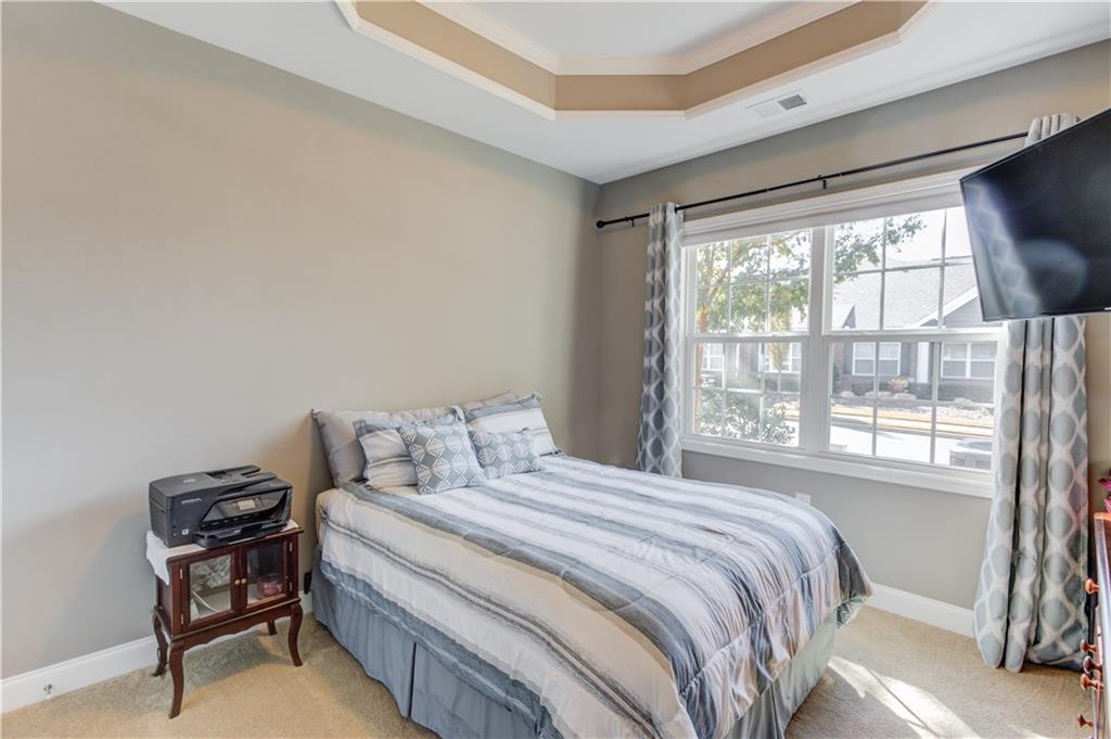 3675 Ridgehurst Drive Buford, GA 30519 - Photo 26 of 43 a bedroom with a bed and a window