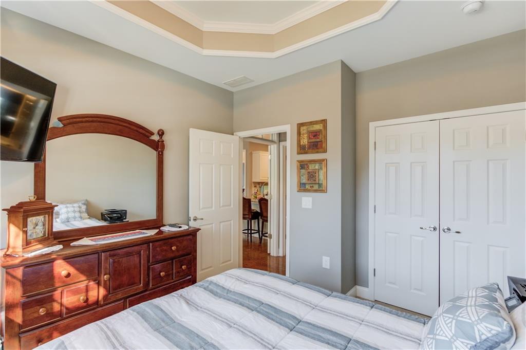 3675 Ridgehurst Drive Buford, GA 30519 - Photo 27 of 43 a bedroom with a bed and a dresser