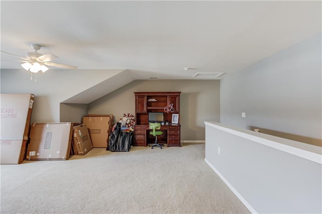 3675 Ridgehurst Drive Buford, GA 30519 - Photo 32 of 43 a view of a livingroom with furniture and a ceiling fan