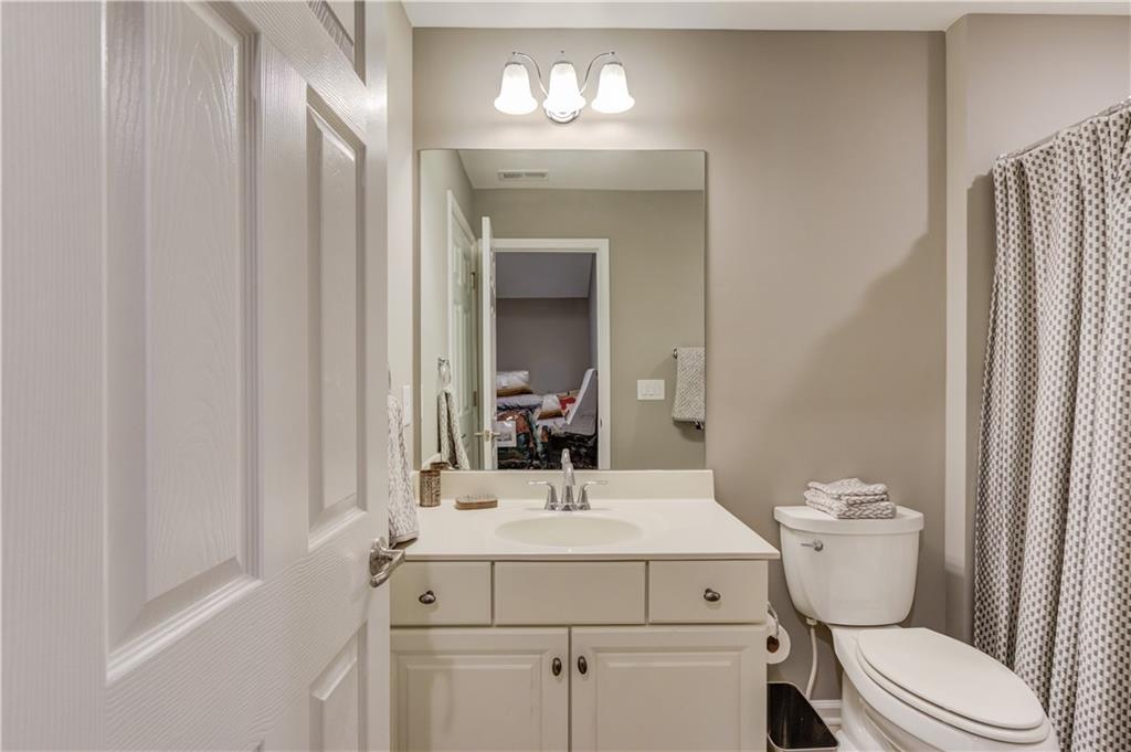 3675 Ridgehurst Drive Buford, GA 30519 - Photo 33 of 43 a bathroom with a sink toilet and shower