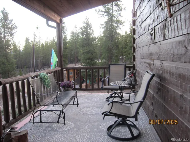 a view of a chairs and tables in the balcony