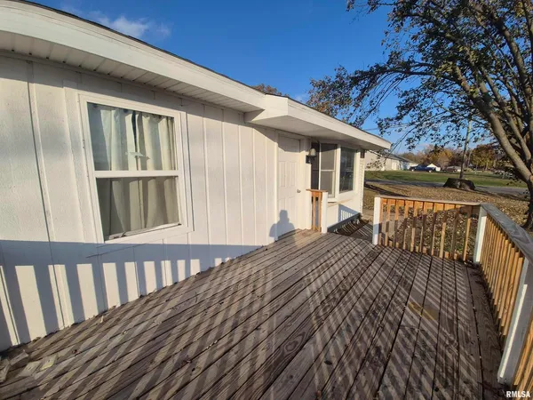 a balcony view with wooden floor and fence