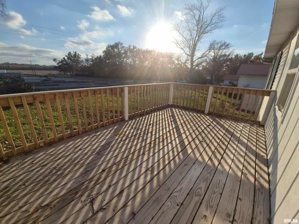 a view of balcony with wooden floor