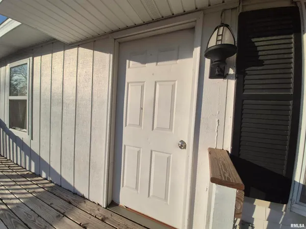 a view of a porch with wooden floor