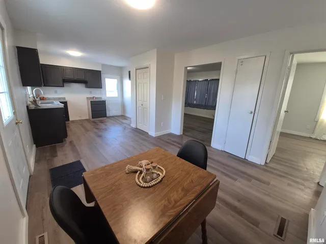 a living room with furniture and flat screen tv