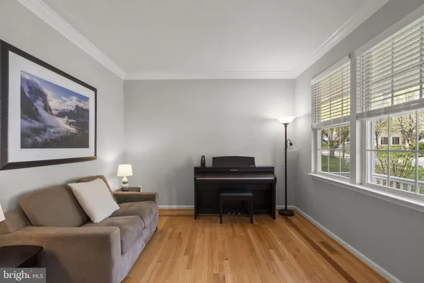 a bedroom with a bed and a lamp