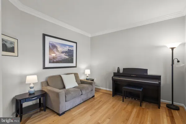 a room with a bed and wooden floor
