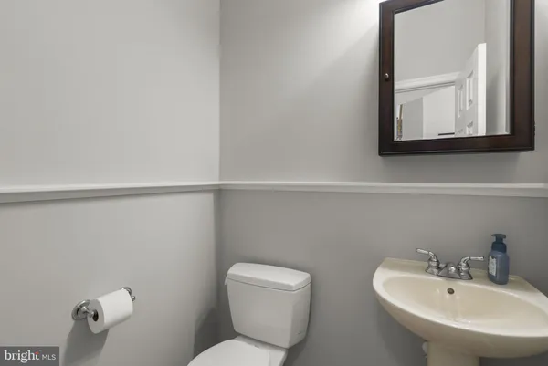 a bedroom with a bed and a bookshelf