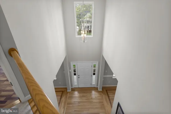 a large bedroom with a bed and a flat screen tv