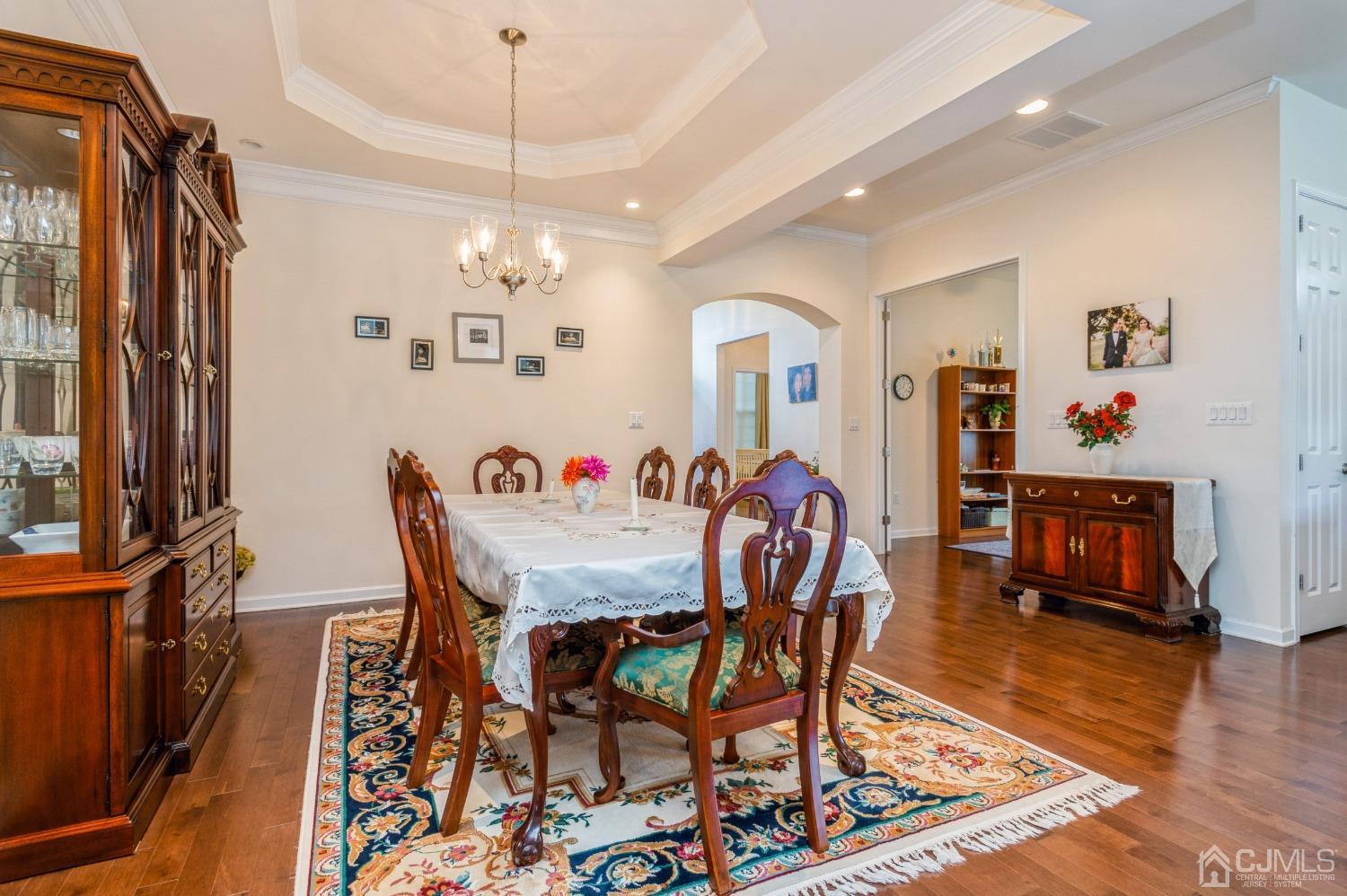 114 Riviera Drive Monroe Township, NJ 08831 - Photo 14 of 40 a view of a dining room with furniture window and wooden floor