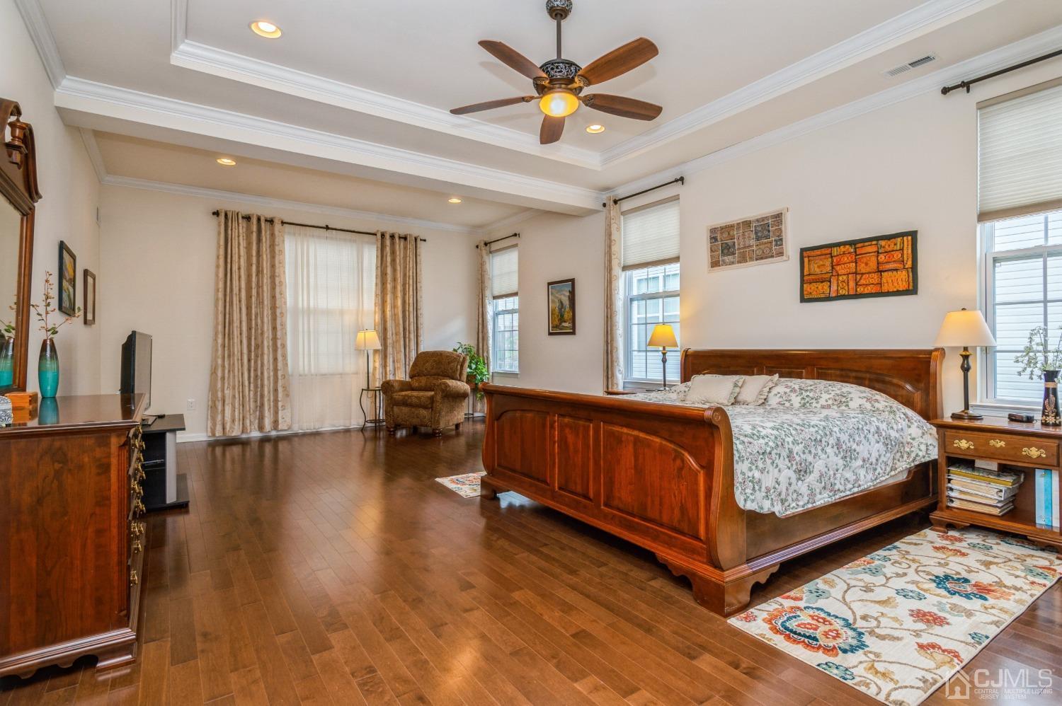 114 Riviera Drive Monroe Township, NJ 08831 - Photo 16 of 40 a bedroom with a bed and wooden floor