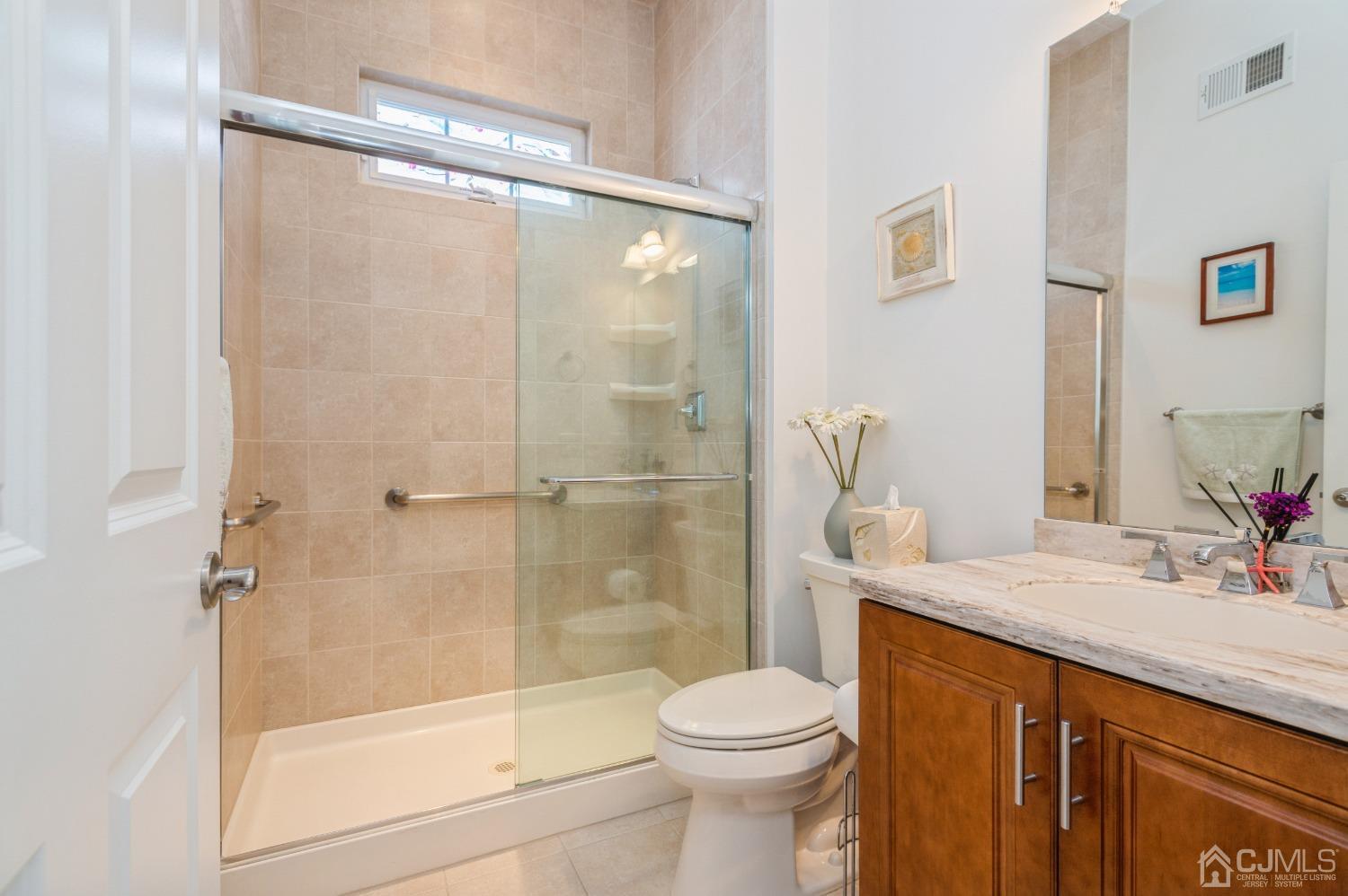 114 Riviera Drive Monroe Township, NJ 08831 - Photo 21 of 40 a bathroom with a sink and a mirror
