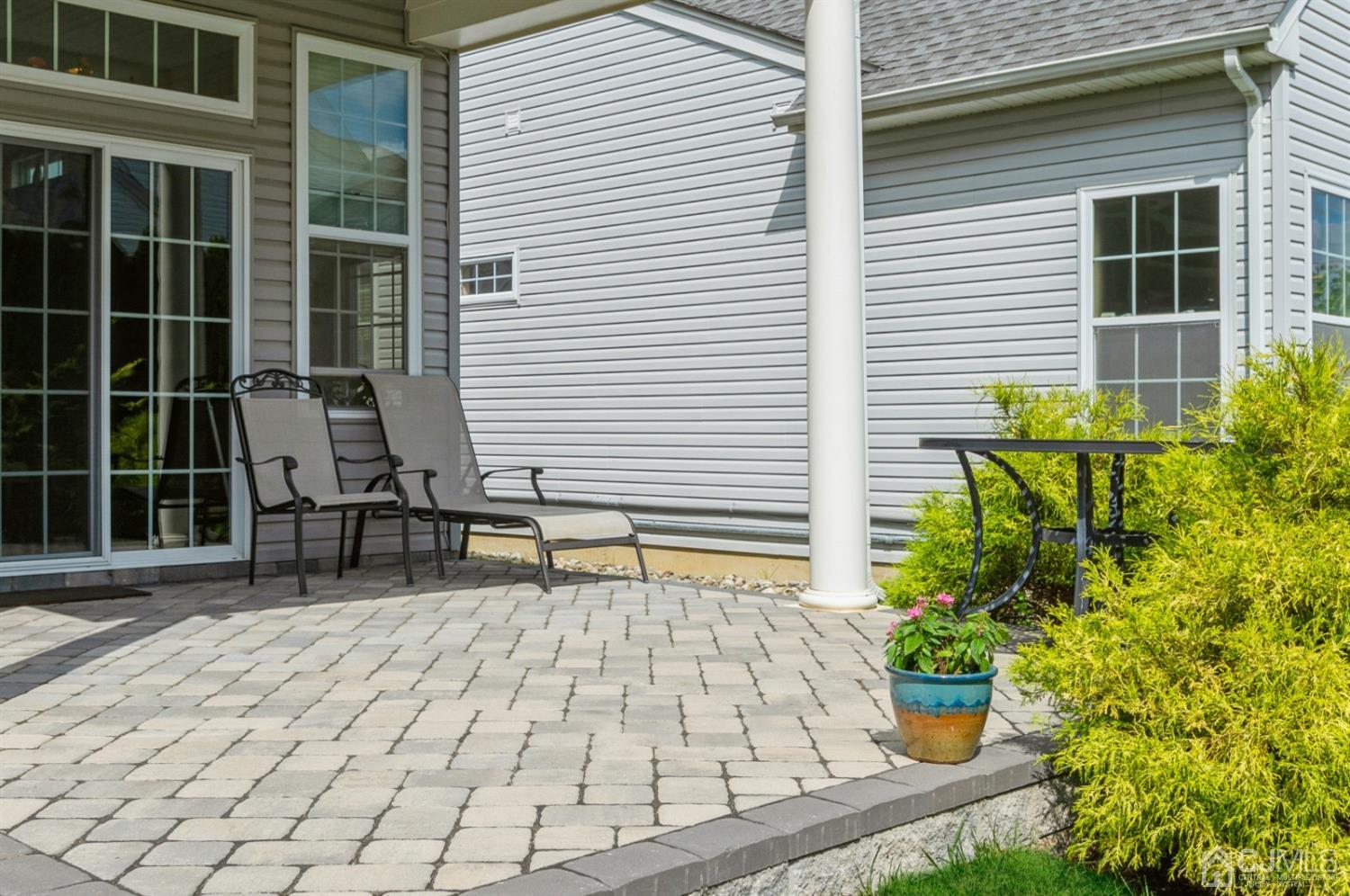 114 Riviera Drive Monroe Township, NJ 08831 - Photo 23 of 40 a building outdoor space with patio furniture and potted plants