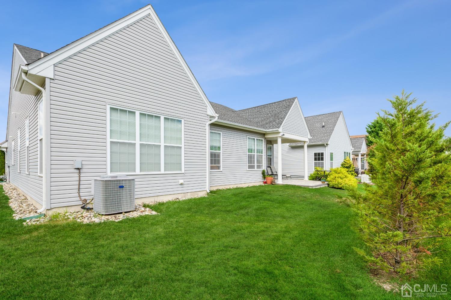 114 Riviera Drive Monroe Township, NJ 08831 - Photo 24 of 40 front view of a house with a yard