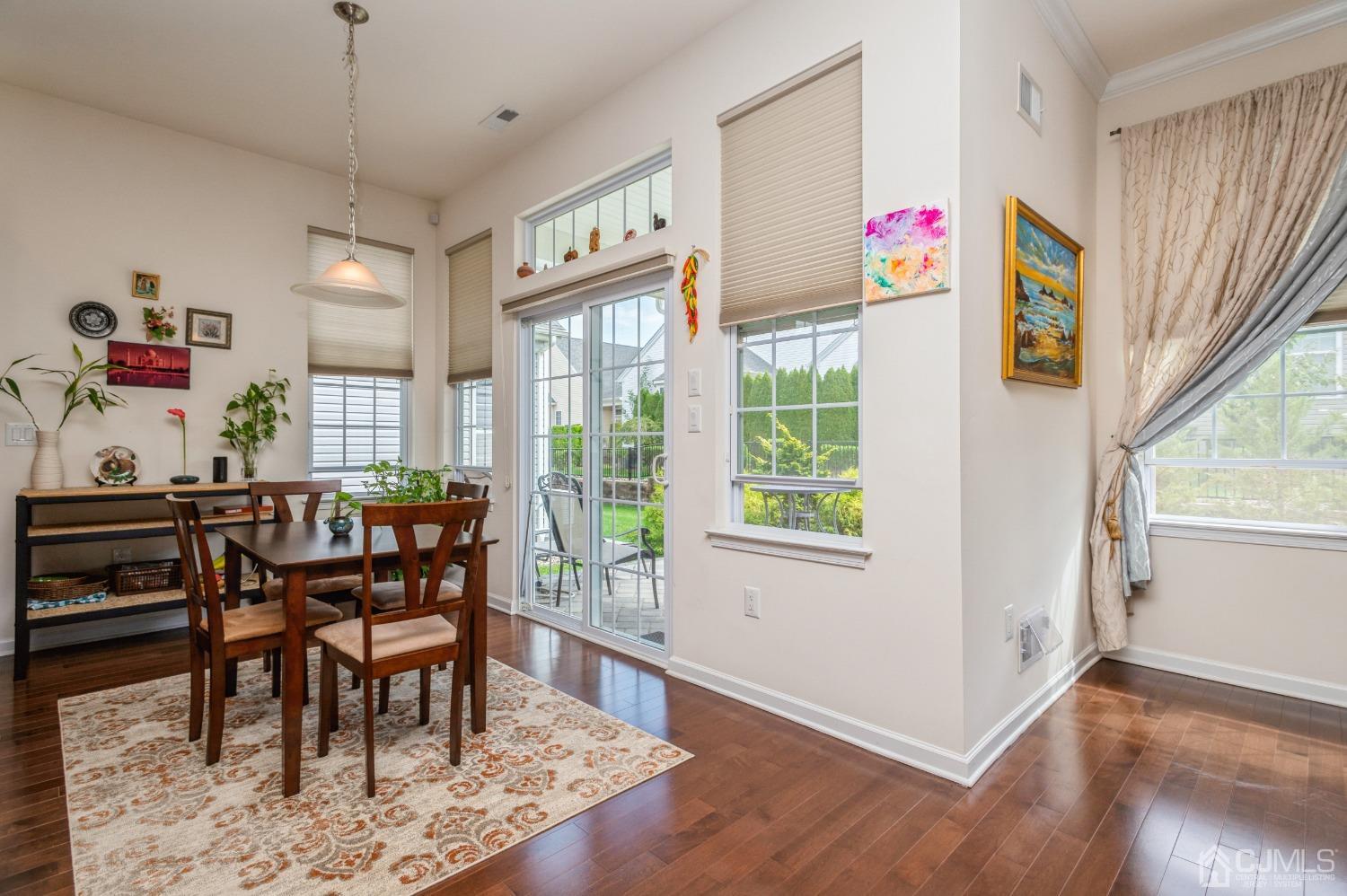 114 Riviera Drive Monroe Township, NJ 08831 - Photo 6 of 40 a view of a dining room with furniture window and wooden floor