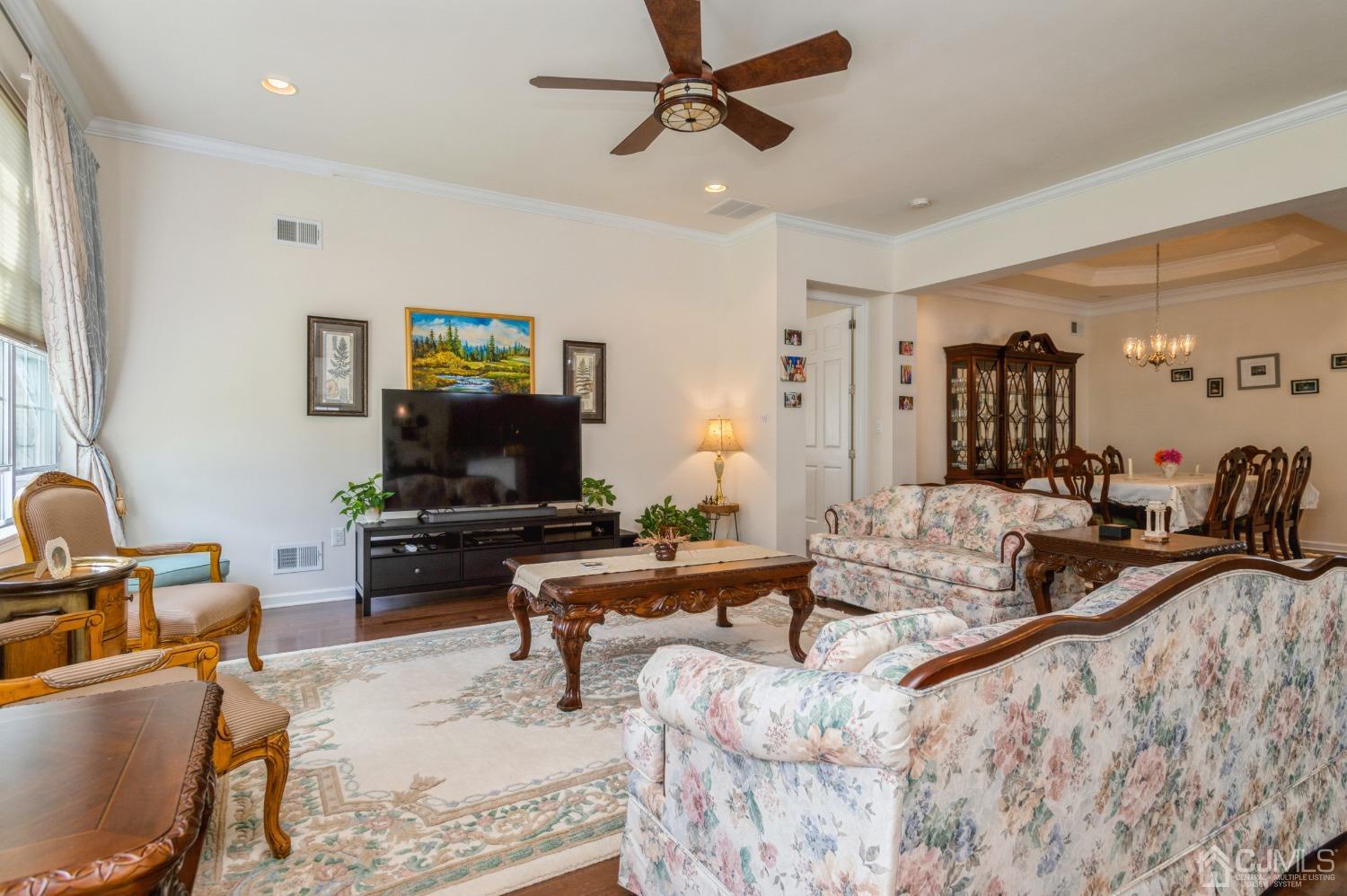 114 Riviera Drive Monroe Township, NJ 08831 - Photo 10 of 40 a living room with furniture and a flat screen tv