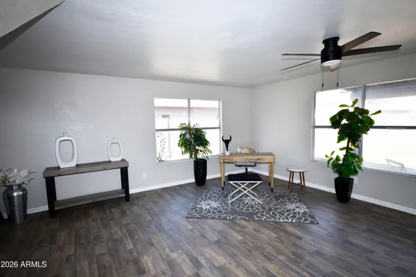 a living room with furniture and a potted plant