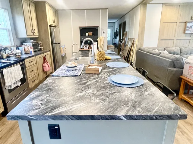 a view of a dining room with furniture and window