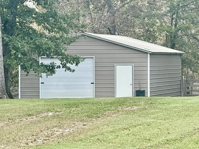 a backyard of a house with lots of green space
