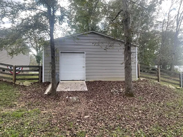a view of a wooden deck and trees