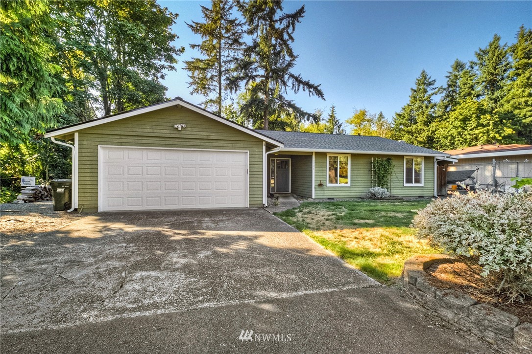 13708 Southeast 141st Street Renton, WA 98059 - Photo 1 of 19 front view of a house with a yard