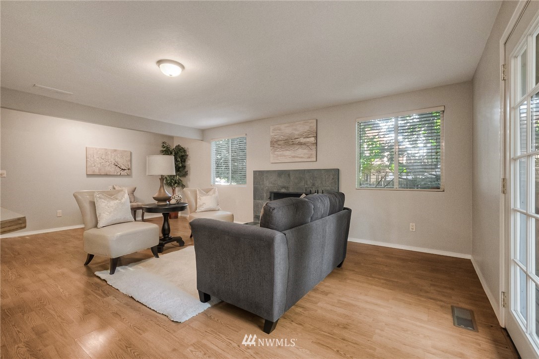 13708 Southeast 141st Street Renton, WA 98059 - Photo 11 of 19 a living room with furniture and a fireplace